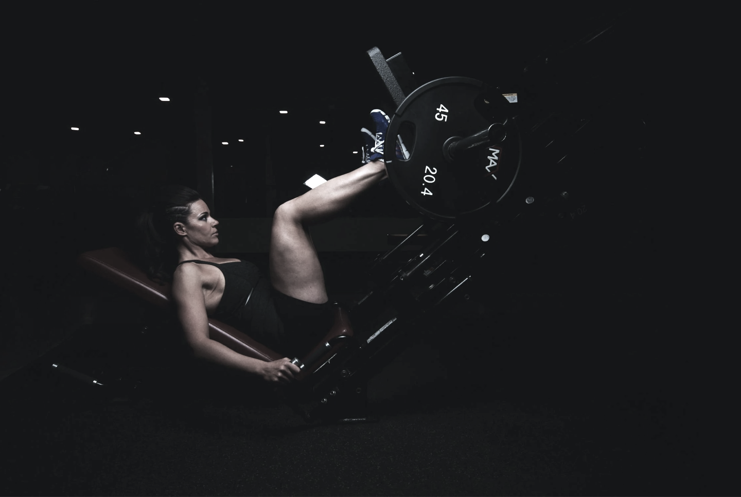 woman using leg press